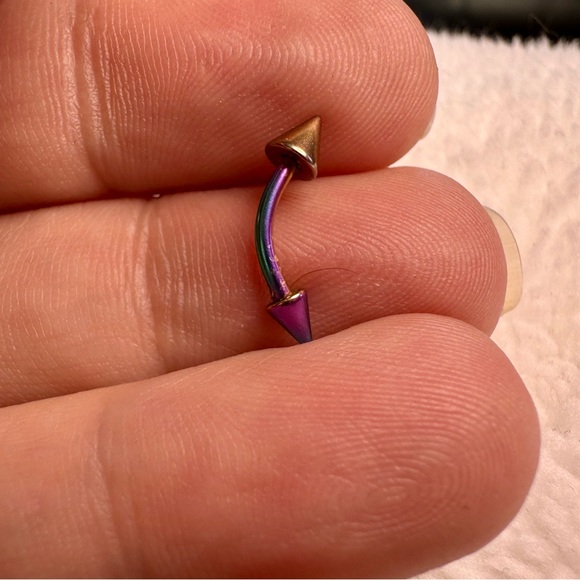 Curved annonized barbell with dual spikes. - Picture 6 of 7